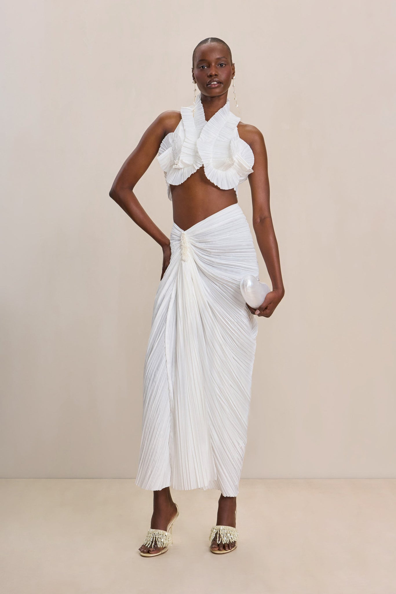 Sculptural curved pleated satin halter top and skirt set
